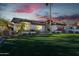 Evening view of home's exterior, highlighting landscaping and architecture at 7514 N 22Nd Pl, Phoenix, AZ 85020