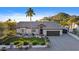 Luxury home exterior, featuring a large yard and palm trees at 7514 N 22Nd Pl, Phoenix, AZ 85020