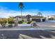 House exterior featuring a two-car garage, manicured lawn, and palm trees at 7514 N 22Nd Pl, Phoenix, AZ 85020
