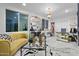 Stylish home office featuring a yellow velvet couch and glass coffee table at 7514 N 22Nd Pl, Phoenix, AZ 85020