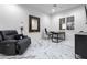 Home office with a comfortable recliner and large window at 7514 N 22Nd Pl, Phoenix, AZ 85020