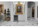 Stylish wet bar with wine cooler and ornate gold framed artwork at 7514 N 22Nd Pl, Phoenix, AZ 85020