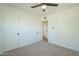 Spacious bedroom with double closets and ceiling fan at 1017 W Whitton Ave, Phoenix, AZ 85013