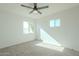 Bright bedroom with ceiling fan and carpet at 1017 W Whitton Ave, Phoenix, AZ 85013