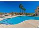 Inviting community pool with lounge chairs and mountain views at 10401 N Saguaro Blvd # 319, Fountain Hills, AZ 85268