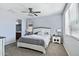 Main bedroom with a rustic-style bed and gray carpet at 12125 W Desert Ln, El Mirage, AZ 85335