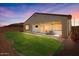 Backyard view at dusk, showing patio and landscaping at 1310 E Beechnut Pl, Chandler, AZ 85249