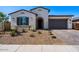 Single-story home with landscaping, driveway, and gray exterior at 1310 E Beechnut Pl, Chandler, AZ 85249