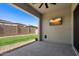 Covered patio with TV and backyard view at 1310 E Beechnut Pl, Chandler, AZ 85249