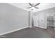 Bright bedroom with ceiling fan, tile floors, and ample closet space at 1421 E Weldon Ave, Phoenix, AZ 85014