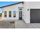 Contemporary home exterior featuring a clean, white facade and modern door at 1421 E Weldon Ave, Phoenix, AZ 85014