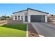 Modern single-story home with attached garage and landscaped lawn at 1421 E Weldon Ave, Phoenix, AZ 85014