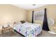 Cozy bedroom with ceiling fan and window at 15013 W Ventura St, Surprise, AZ 85379