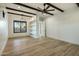 Spacious bedroom featuring built-in shelving and wood flooring at 1583 S 155Th St, Gilbert, AZ 85296