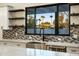 Modern kitchen with a farmhouse sink and a large window overlooking the backyard at 1583 S 155Th St, Gilbert, AZ 85296