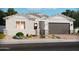 One-story home with a two-car garage and landscaping at 17703 W Southgate Ave, Goodyear, AZ 85338