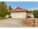 Single-story home with red tile roof and attached garage at 18427 N 36Th Ln, Glendale, AZ 85308