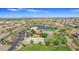 Aerial view of community with lake, pool, playground, and homes at 2008 E Stacey Rd, Gilbert, AZ 85298
