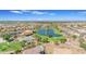 Aerial view of community with lake, pool, playground, and homes at 2008 E Stacey Rd, Gilbert, AZ 85298