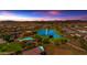 Aerial view of community with lake, pool, playground, and homes at 2008 E Stacey Rd, Gilbert, AZ 85298