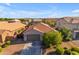 One-story home with tile roof, two-car garage, and desert landscaping at 2008 E Stacey Rd, Gilbert, AZ 85298