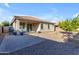 Landscaped backyard with covered patio, fire pit, and grill at 2008 E Stacey Rd, Gilbert, AZ 85298