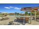 Relaxing community pool with shaded seating and a fun splash pad for  at 2008 E Stacey Rd, Gilbert, AZ 85298