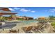 Inviting community pool area with lounge chairs and umbrellas at 2008 E Stacey Rd, Gilbert, AZ 85298