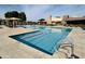 Community pool with lap lanes, lounge chairs, and shade umbrellas at 2008 E Stacey Rd, Gilbert, AZ 85298