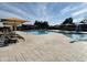 Inviting community pool with ample seating and shade umbrellas at 2008 E Stacey Rd, Gilbert, AZ 85298