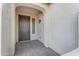 Front entry with dark brown door and tile flooring at 2008 E Stacey Rd, Gilbert, AZ 85298