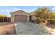 Single-story house with a two-car garage and well-maintained landscaping at 2008 E Stacey Rd, Gilbert, AZ 85298
