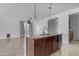 Island kitchen with granite countertops and modern sink at 2008 E Stacey Rd, Gilbert, AZ 85298