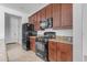 Kitchen features granite countertops and dark wood cabinets at 2008 E Stacey Rd, Gilbert, AZ 85298