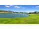 Serene lake with fountains and lush green landscaping at 2008 E Stacey Rd, Gilbert, AZ 85298