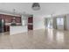 Open living room and kitchen with tile flooring and neutral color palette at 2008 E Stacey Rd, Gilbert, AZ 85298