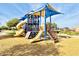 Playground with slides, climbing structures, and a shaded area at 2008 E Stacey Rd, Gilbert, AZ 85298