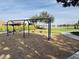 Playground with swings, a water fountain, and a grassy area at 2008 E Stacey Rd, Gilbert, AZ 85298