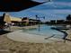 pool area with a splash pad, lounge chairs, and shade structures at 2008 E Stacey Rd, Gilbert, AZ 85298