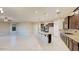 Modern kitchen with granite countertops and dark wood cabinets at 20856 E Arroyo Verde Dr, Queen Creek, AZ 85142