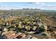 Aerial view of a residential neighborhood with houses, streets, and desert landscape in the background at 2317 W Horsetail Trl, Phoenix, AZ 85085