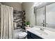 Updated bathroom with a tiled shower, modern vanity, and decorative tile accents at 2317 W Horsetail Trl, Phoenix, AZ 85085