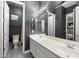 Stylish bathroom with dual sinks, a large mirror, and contemporary fixtures at 2317 W Horsetail Trl, Phoenix, AZ 85085
