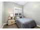 A comfortable bedroom with neutral decor, a window, and a simple bed at 2317 W Horsetail Trl, Phoenix, AZ 85085