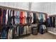 Well-organized walk-in closet with ample storage space for clothes and accessories at 2317 W Horsetail Trl, Phoenix, AZ 85085