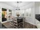 Bright dining area with access to the backyard, perfect for Gathering meals at 2317 W Horsetail Trl, Phoenix, AZ 85085