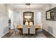 Formal dining room with a stylish chandelier and a large mirror at 2317 W Horsetail Trl, Phoenix, AZ 85085