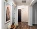 Welcoming entryway with wood-look tile flooring and an eye-catching horse artwork at 2317 W Horsetail Trl, Phoenix, AZ 85085