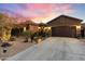 Inviting single-story home with desert landscaping and attached two-car garage at 2317 W Horsetail Trl, Phoenix, AZ 85085