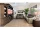 Gathering room featuring built-in entertainment center, comfy seating, and large windows at 2317 W Horsetail Trl, Phoenix, AZ 85085